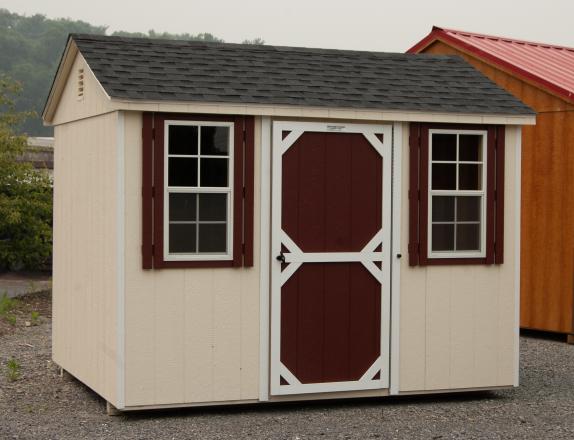 8x10 Peak Roof Style Storage Shed with Cream Siding, White Trim, Red Door, and Red Shutters